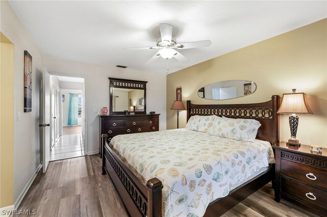 bedroom featuring ceiling fan and wood-type flooring