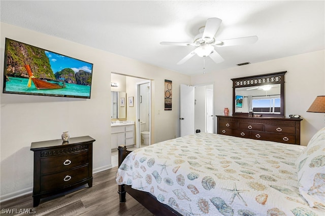 bedroom featuring hardwood / wood-style flooring, ceiling fan, and connected bathroom