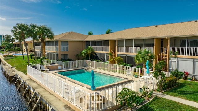 view of pool featuring a water view