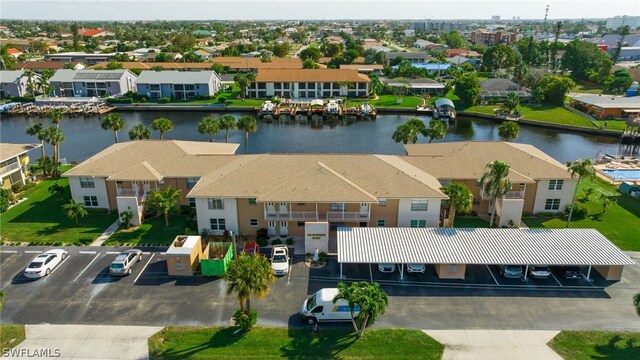 aerial view with a residential view and a water view