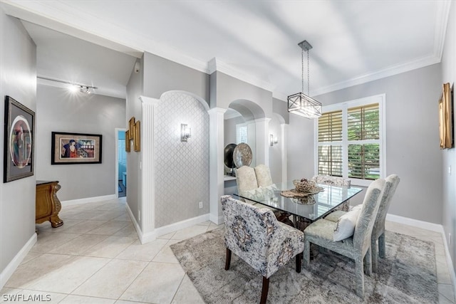 tiled dining room with ornate columns and crown molding