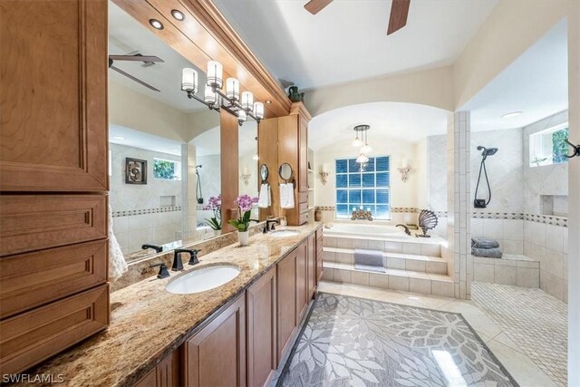 bathroom with ceiling fan, vanity, decorative columns, tile patterned floors, and shower with separate bathtub