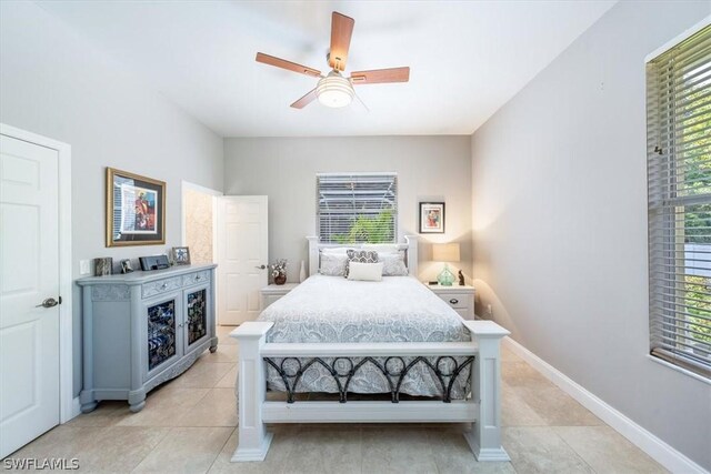 bedroom featuring light tile patterned floors and ceiling fan