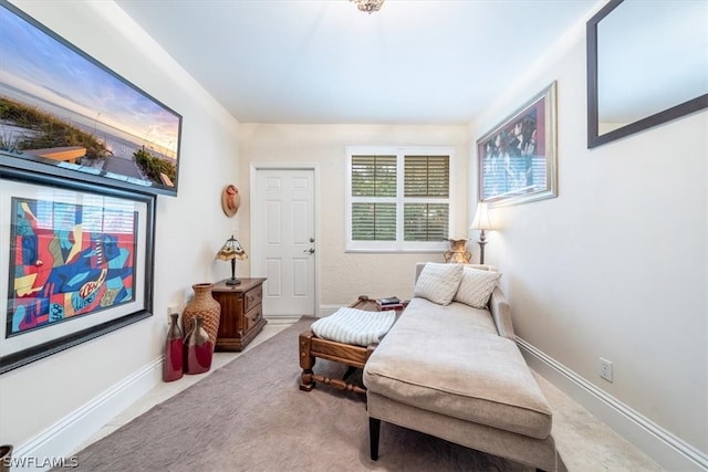 sitting room with carpet flooring and plenty of natural light