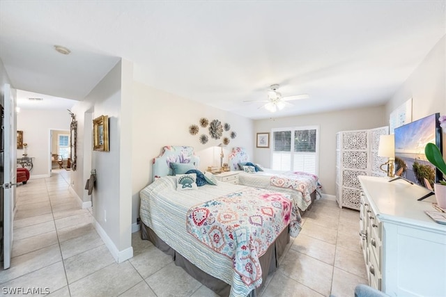 bedroom featuring ceiling fan and light tile patterned flooring