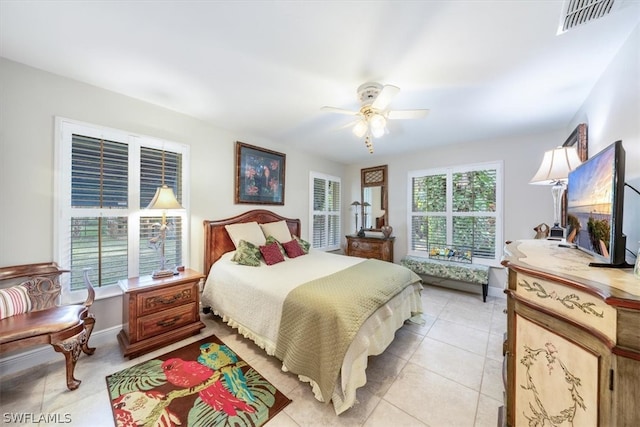 tiled bedroom with ceiling fan