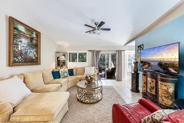 tiled living room featuring vaulted ceiling and ceiling fan