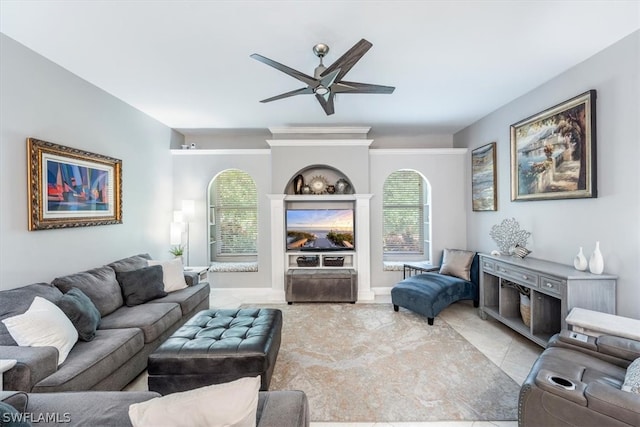 tiled living room featuring ceiling fan