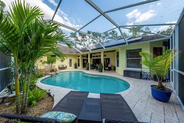 view of pool with a patio, an outdoor living space, a lanai, and ceiling fan