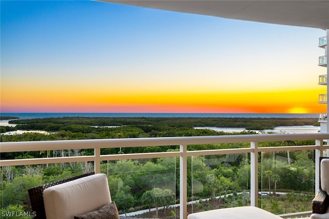 balcony at dusk with a water view