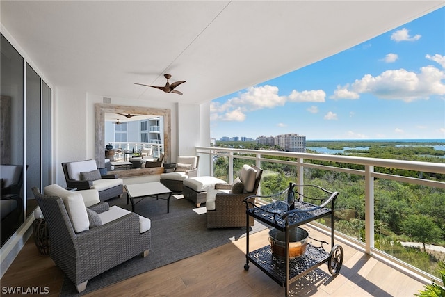 balcony with ceiling fan and outdoor lounge area