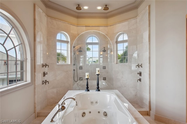 bathroom featuring ornamental molding and a tile shower