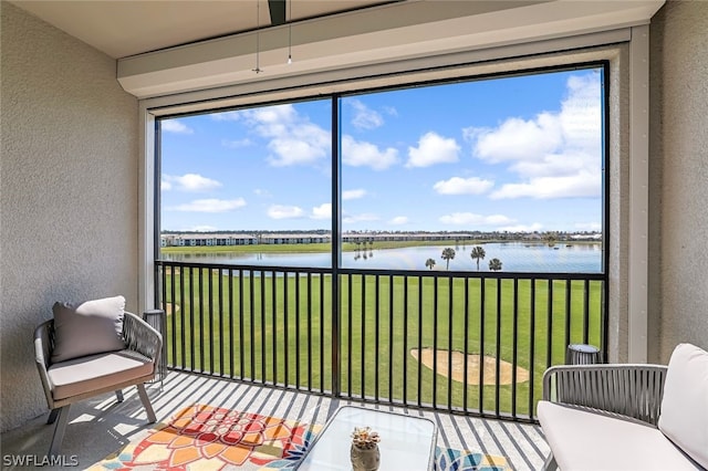 sunroom with a water view