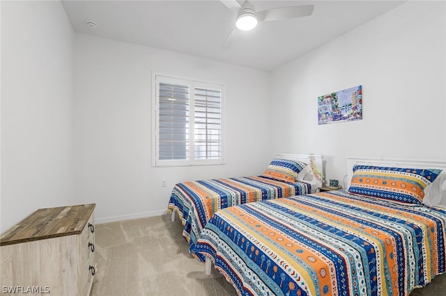 bedroom featuring a ceiling fan, carpet flooring, and baseboards