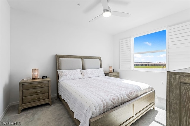 bedroom featuring ceiling fan, baseboards, and carpet flooring