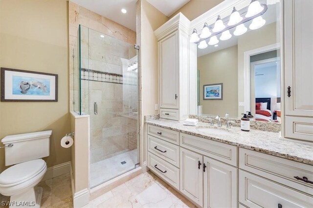 bathroom with vanity, toilet, and walk in shower