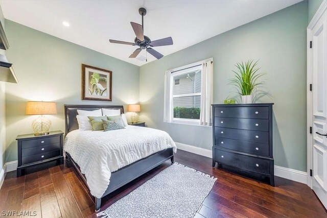 bedroom featuring ceiling fan and dark hardwood / wood-style floors