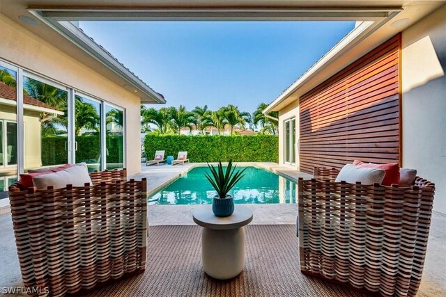 view of swimming pool with a patio area