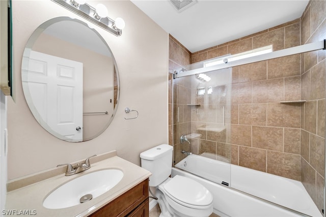 full bathroom with vanity, toilet, and combined bath / shower with glass door