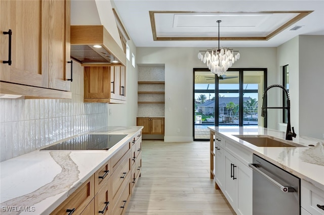 kitchen featuring stainless steel dishwasher, a notable chandelier, white cabinetry, and premium range hood