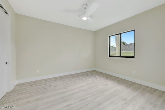 empty room featuring light hardwood / wood-style flooring and ceiling fan