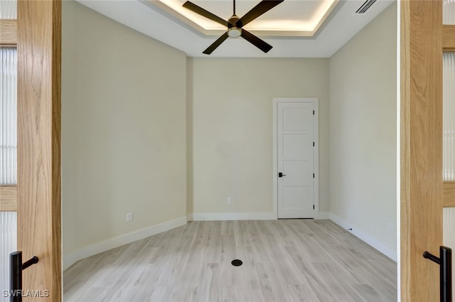 spare room featuring ceiling fan and light hardwood / wood-style floors