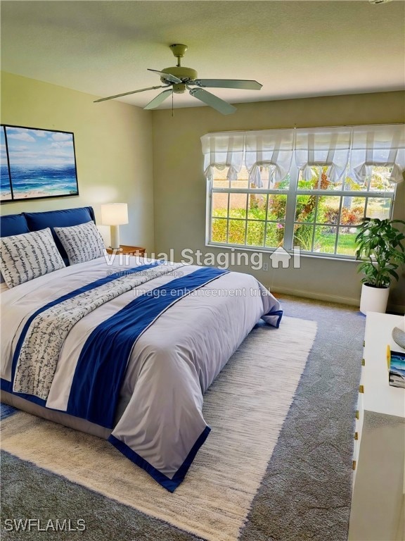 carpeted bedroom featuring ceiling fan