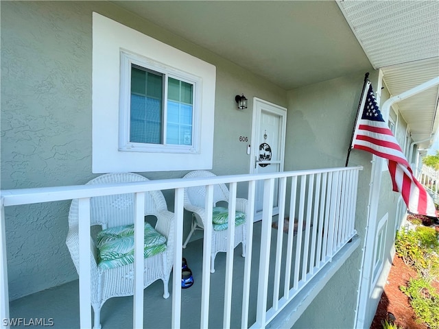 view of exterior entry featuring stucco siding