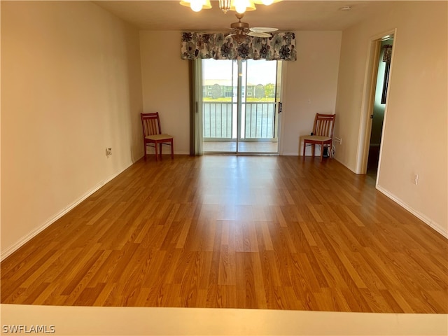 spare room featuring ceiling fan and wood-type flooring