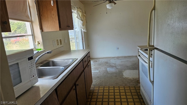 kitchen with ceiling fan, tasteful backsplash, white appliances, light tile floors, and sink