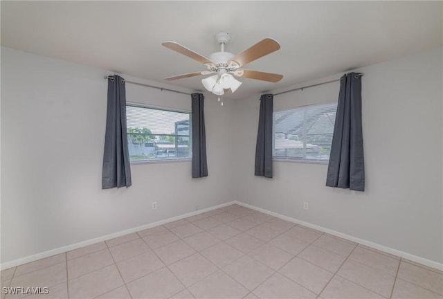 2201 SE 10th Ave, Cape Coral, FL 33990 - unfurnished room with plenty of natural light, ceiling fan, and baseboards