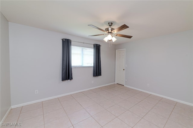 tiled empty room with ceiling fan