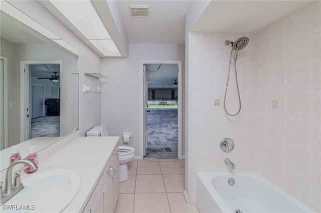 2201 SE 10th Ave, Cape Coral, FL 33990 - full bath featuring vanity, shower / bath combination, ceiling fan, tile patterned floors, and toilet