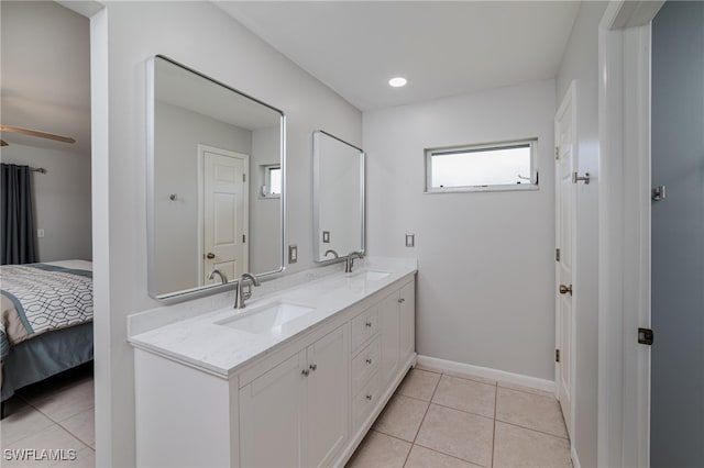 bathroom with dual vanity and tile patterned floors