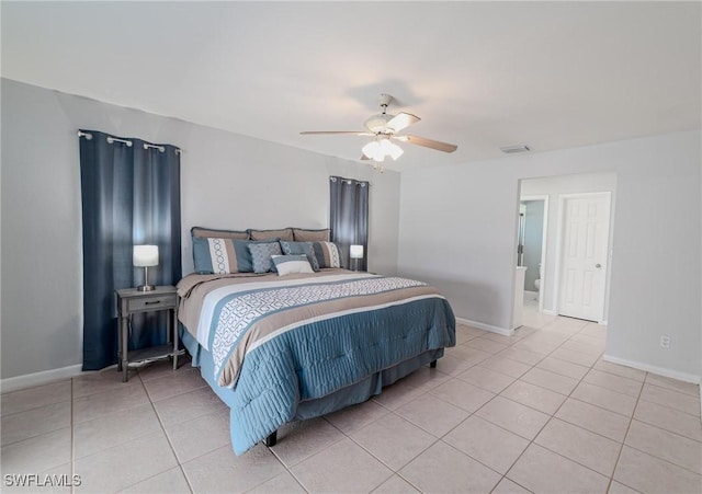 tiled bedroom featuring ceiling fan