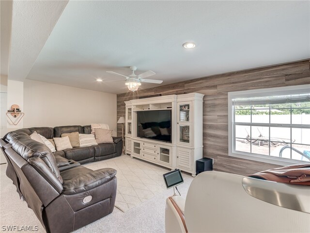 living area featuring recessed lighting, light carpet, and ceiling fan