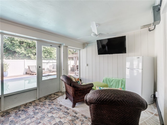 interior space featuring visible vents and a ceiling fan