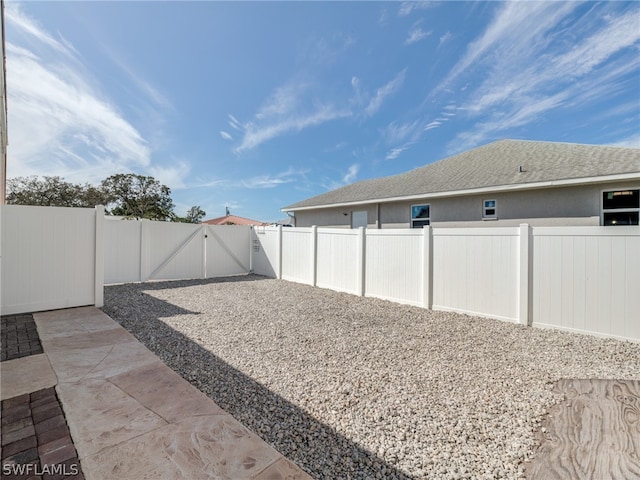 view of yard with a patio area and a fenced backyard