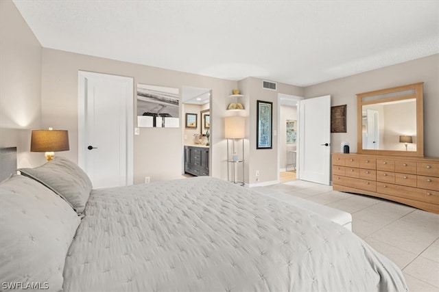 tiled bedroom with ensuite bath