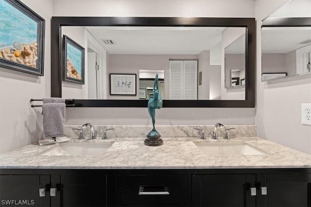 bathroom featuring double sink and oversized vanity