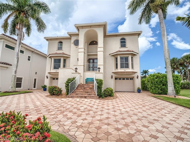 mediterranean / spanish-style house featuring a garage