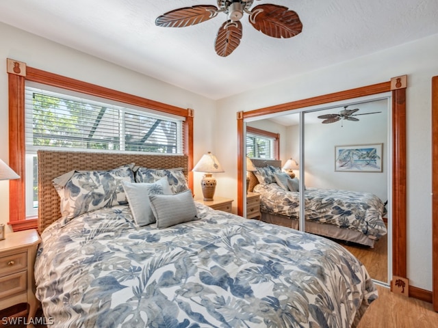 bedroom featuring a closet, ceiling fan, and hardwood / wood-style floors