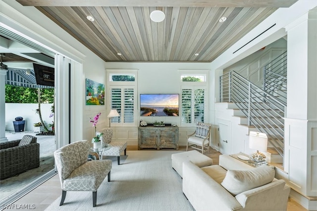 sitting room featuring wooden ceiling, a wealth of natural light, and light hardwood / wood-style floors