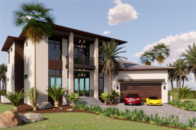 view of front of house with french doors, a balcony, and a garage