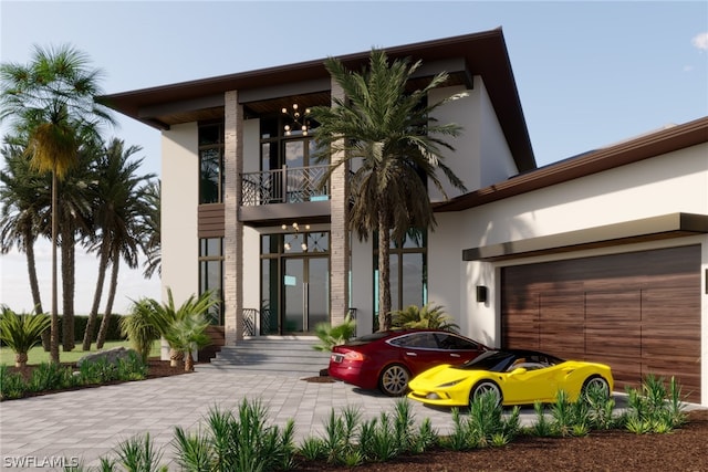 entrance to property with a garage and a balcony