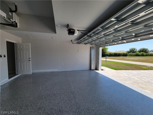 garage featuring a garage door opener