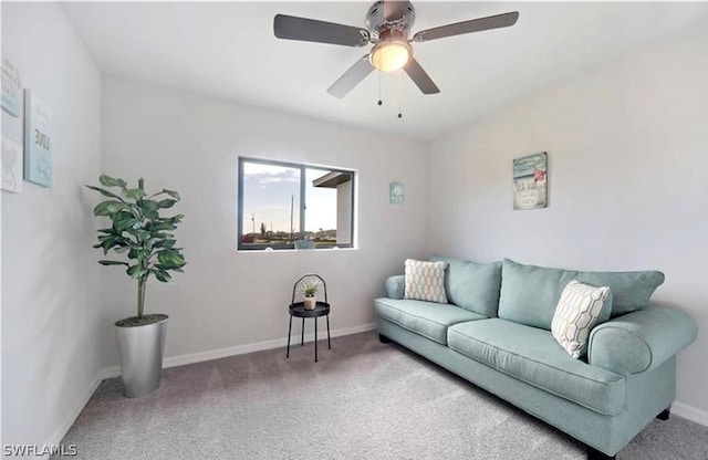 carpeted living room featuring ceiling fan