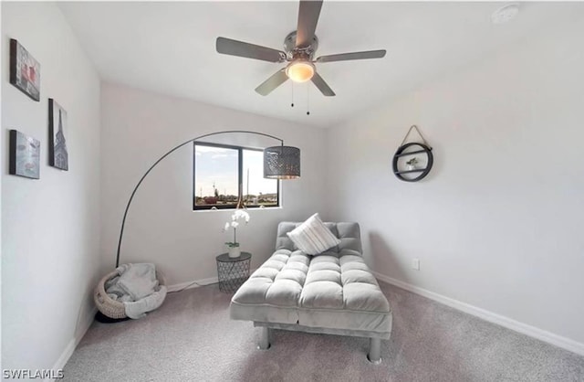 living area featuring ceiling fan and carpet floors