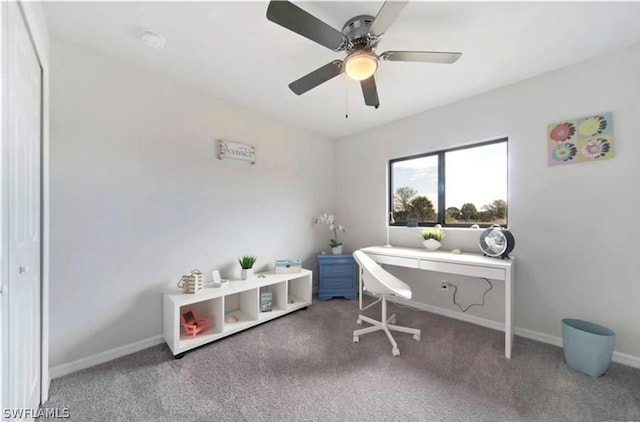 carpeted office space with ceiling fan