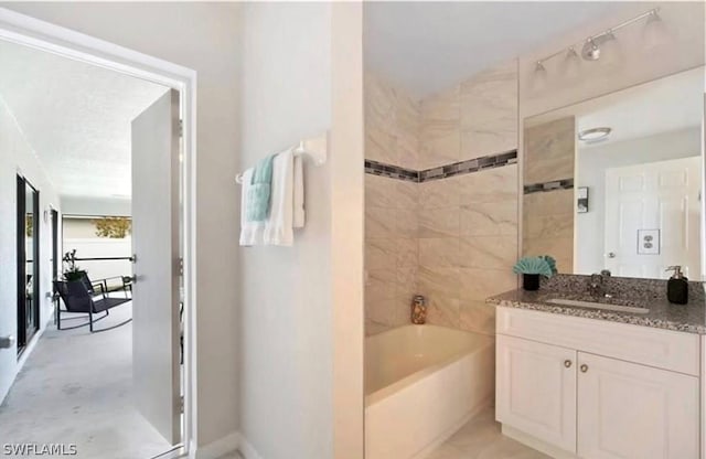 bathroom with concrete flooring, vanity, and independent shower and bath